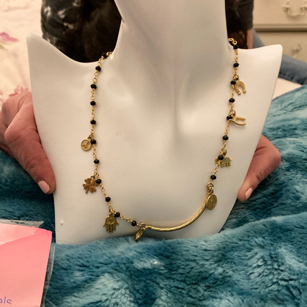 Gold and black lucky charms necklace ( model shows longest length)